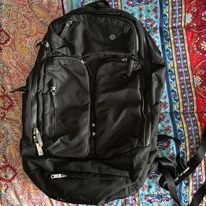 Lululemon large black multi pocket Backpack